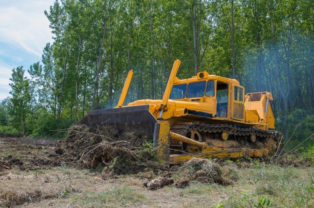 Clearing land with a bulldozer